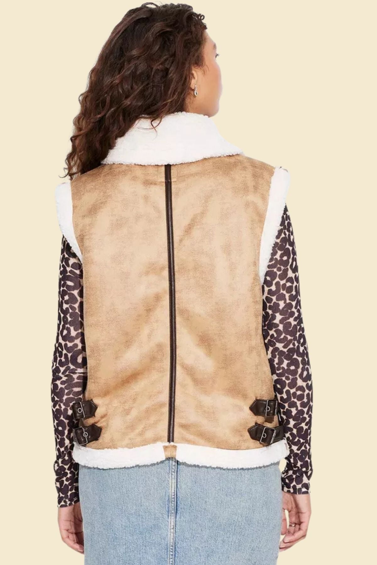 Brown leather vest for women featuring faux fur trim and classic aviator cut.