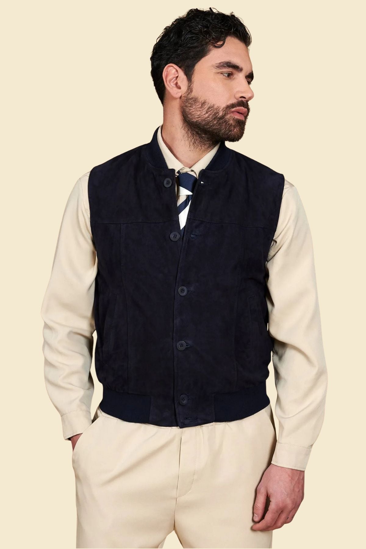 suede texture and Western yoke stitching on men’s black leather vest.