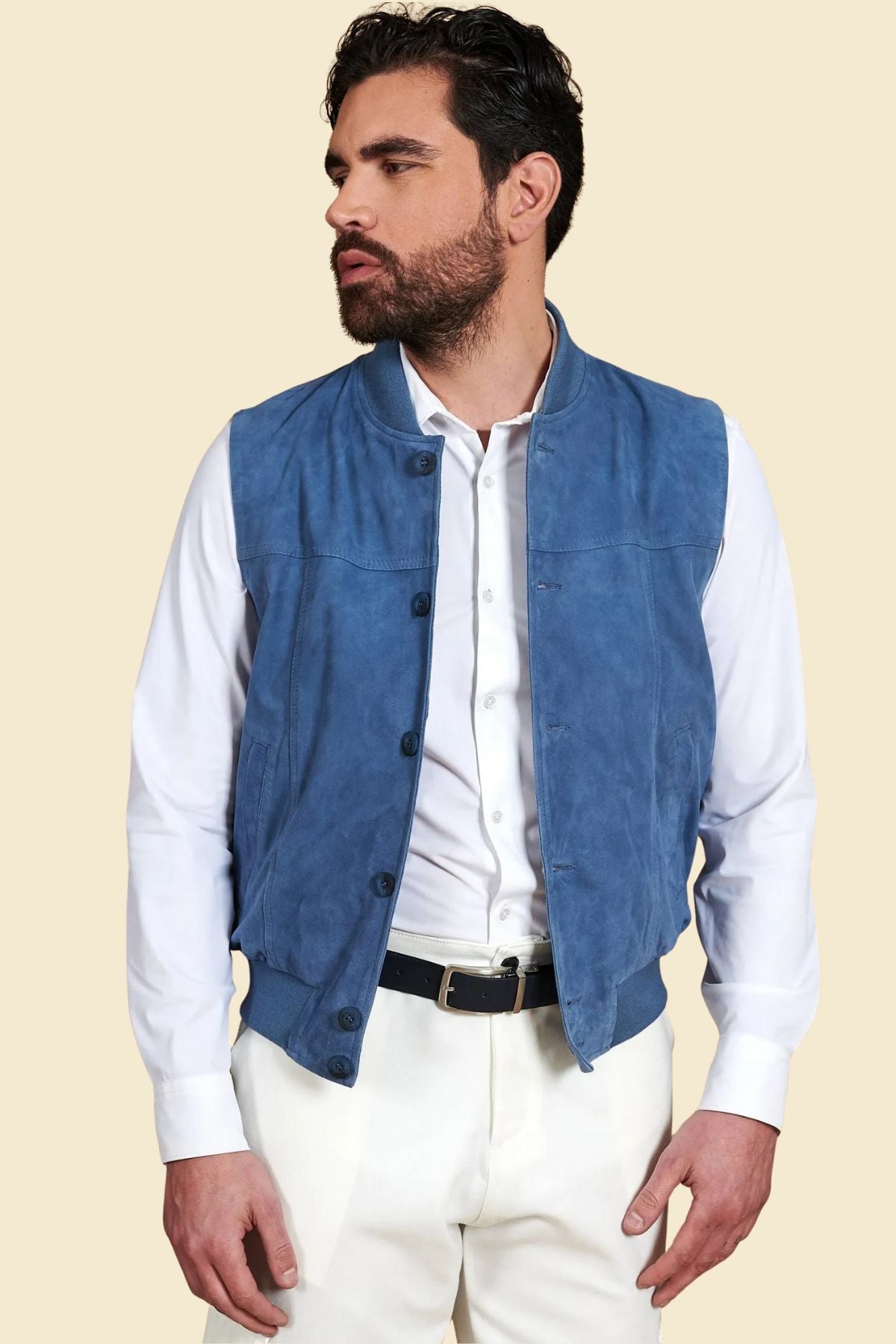 blue suede vest layered over hoodie for a bold streetwear-inspired outfit.