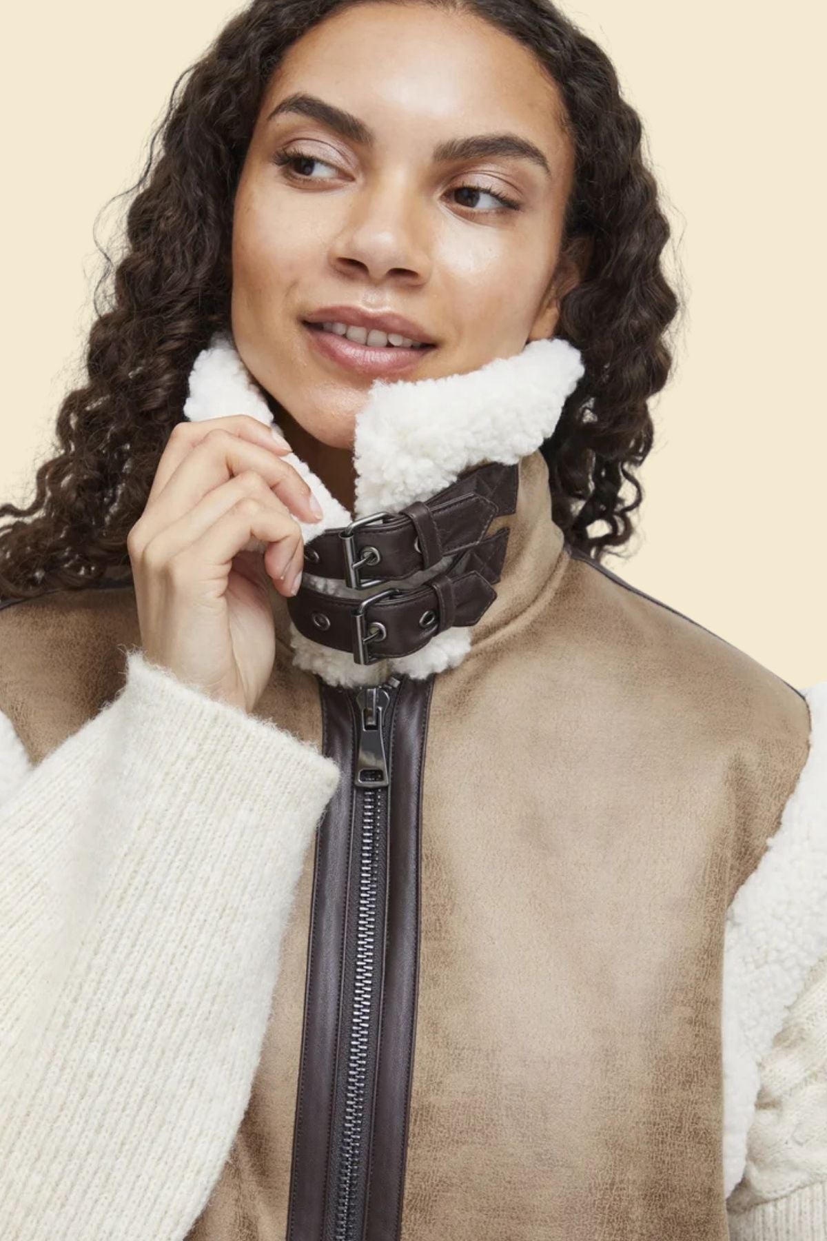 Classic aviator-style vest for women featuring cozy faux fur and vintage leather.