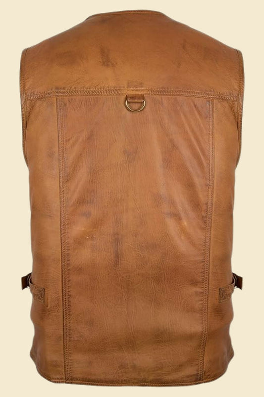 Close-up of functional exterior pocket detail on brown leather motorcycle vest for men.
