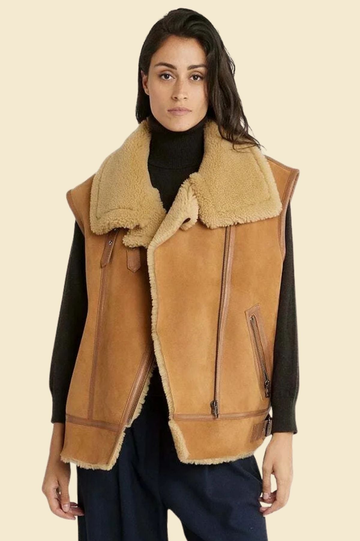 Classic brown leather flight vest styled for women with cozy shearling interior.