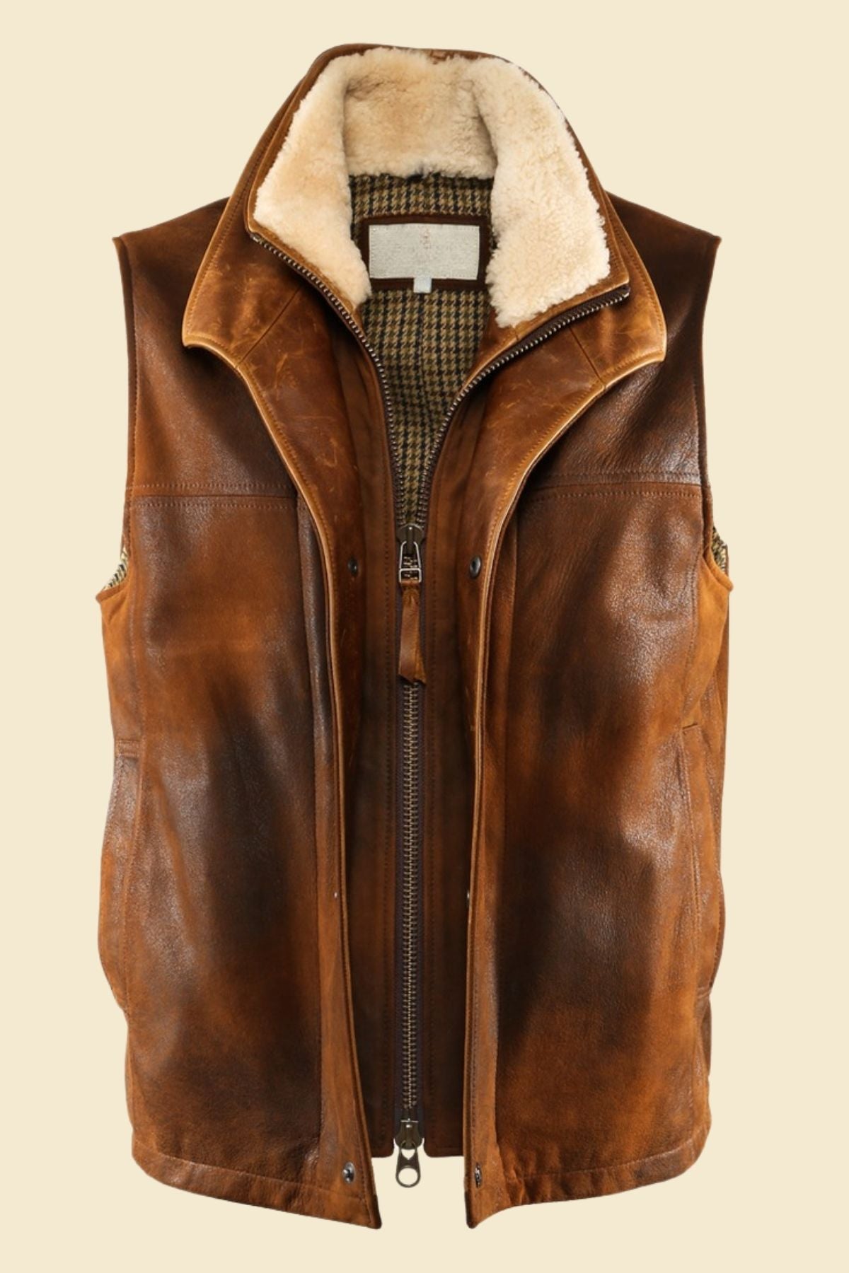 distressed leather vest with fur collar styled in casual streetwear outfit.
