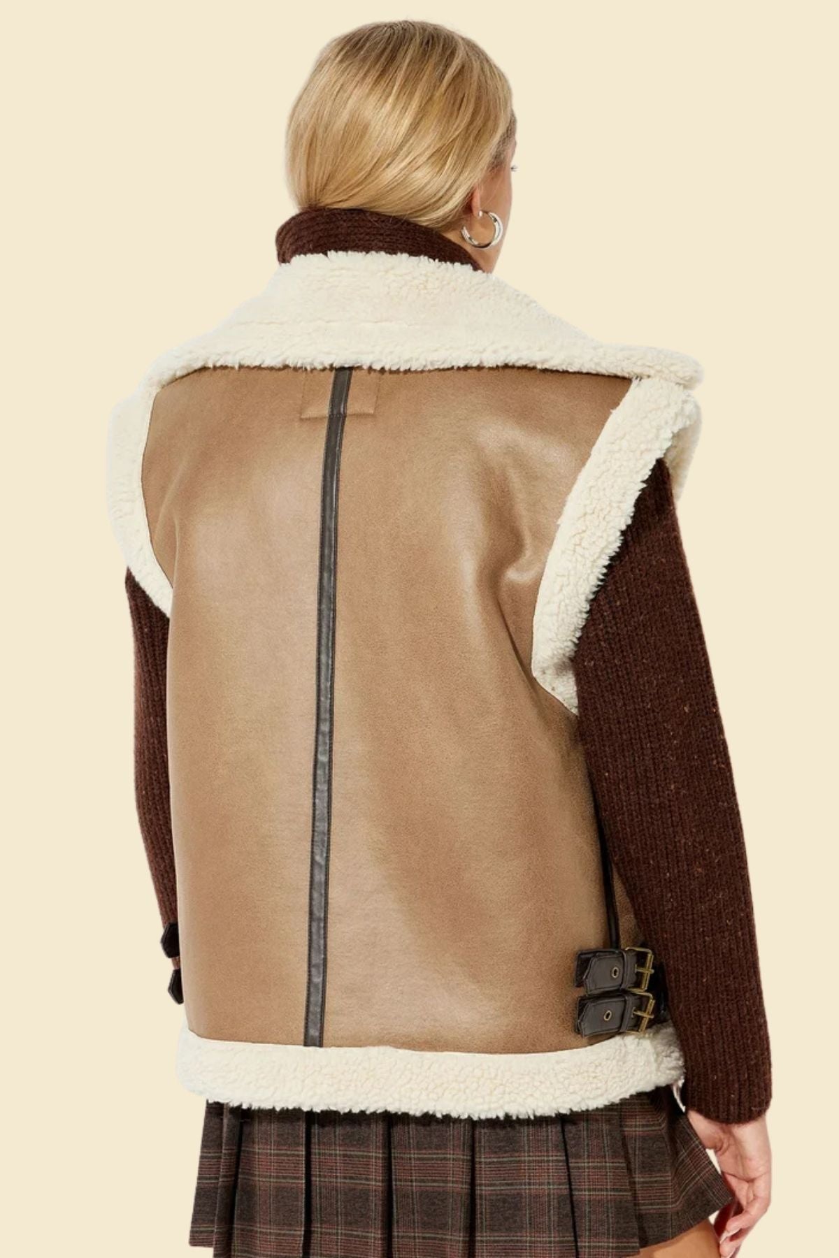 Stylish faux fur vest for women with genuine lambskin leather outer.