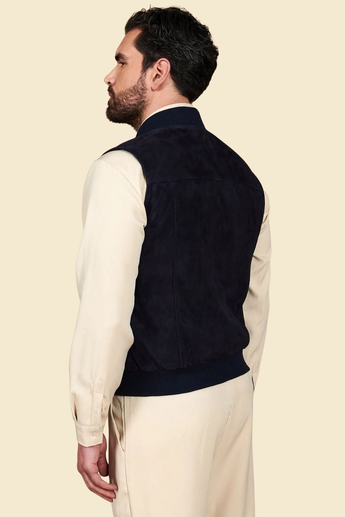 black suede Western vest styled with denim and boots for a rugged cowboy-inspired look.