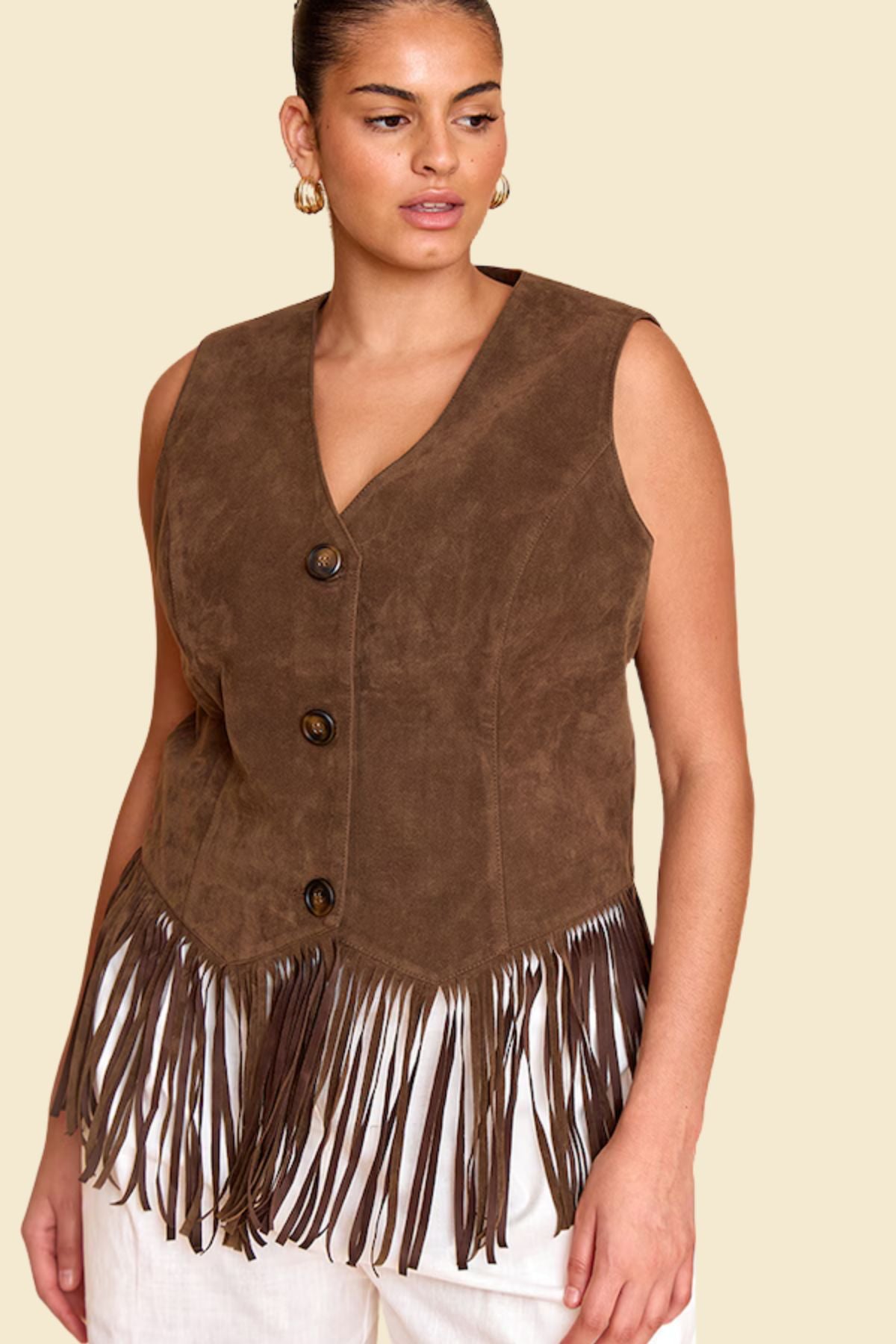 Cowgirl-style brown fringe vest for women made of suede.