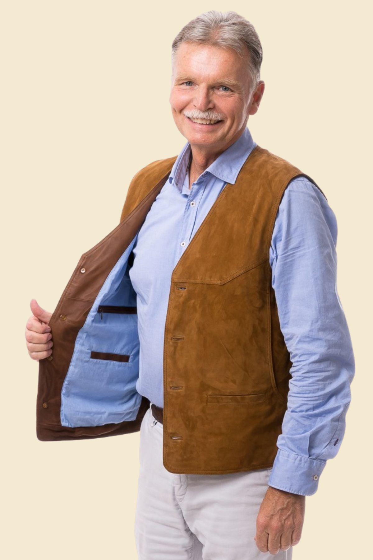 suede vest for men styled casually with denim and boots in a Western-inspired look.