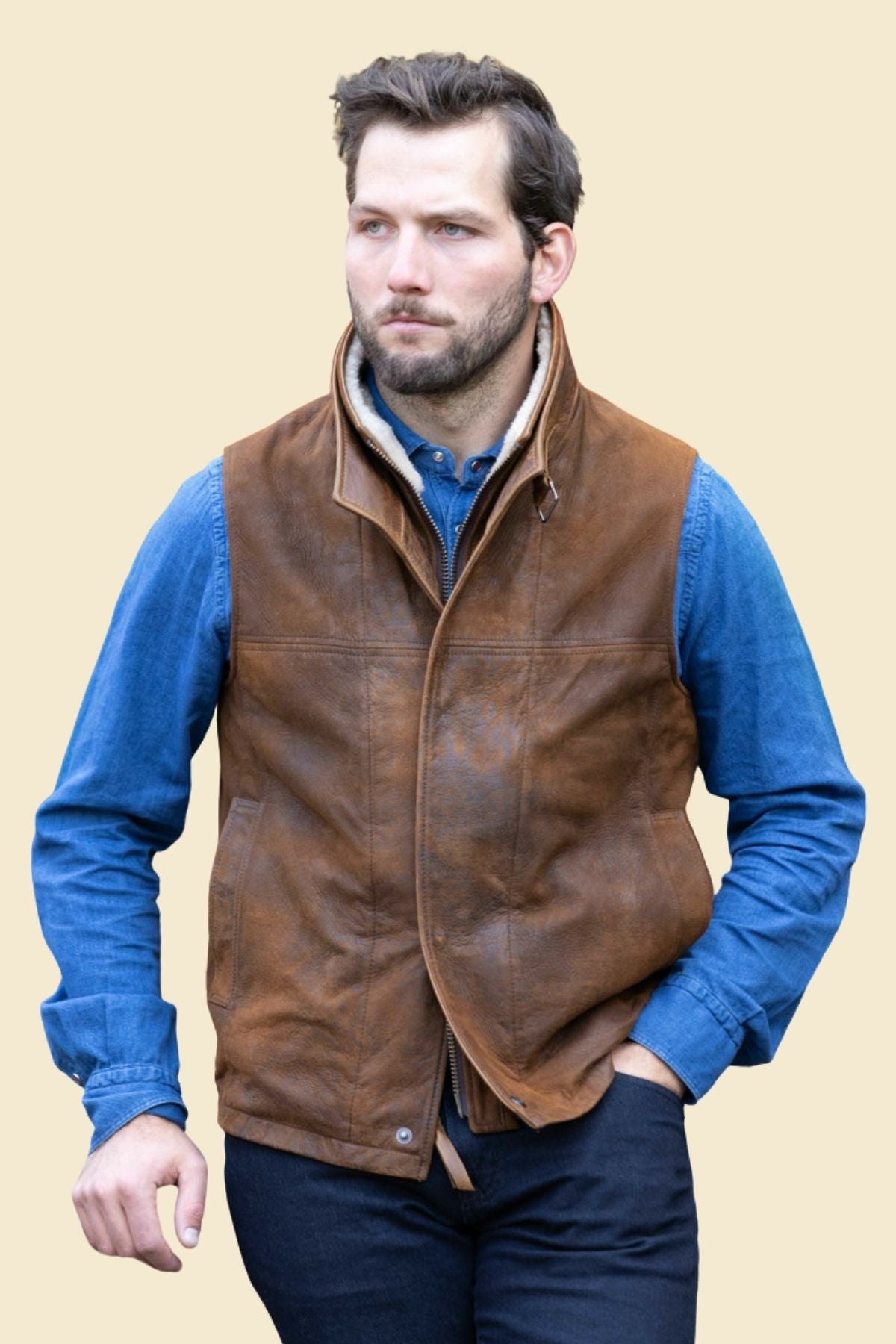 rugged leather texture and faux fur collar on men’s distressed leather vest.