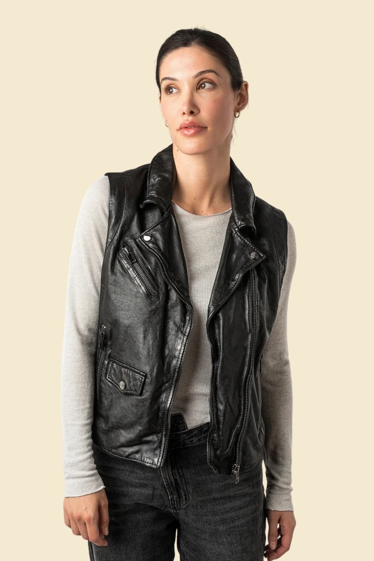 Sleek black leather vest for women featuring a tailored fit and soft polyester lining.
