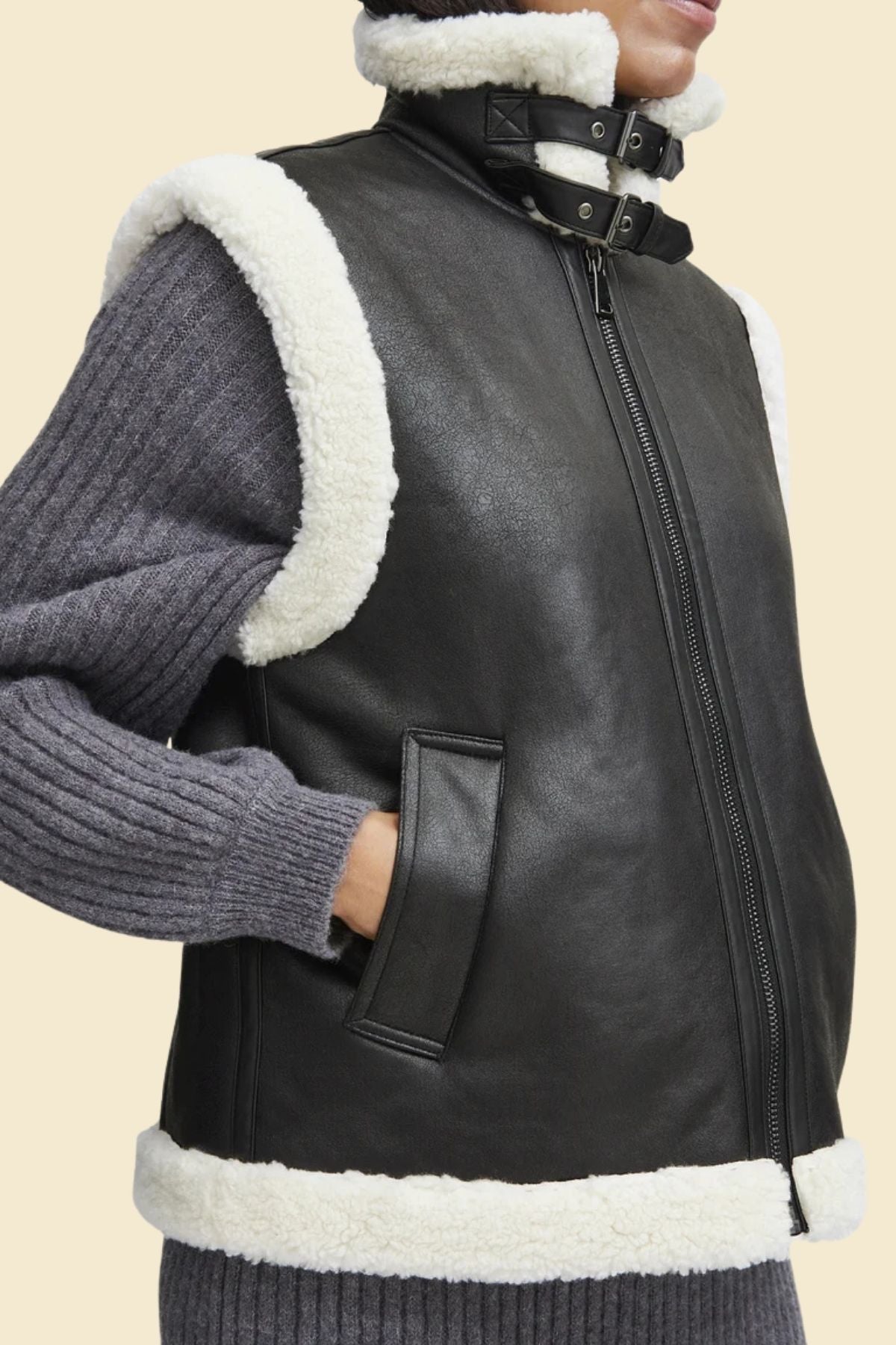 Genuine leather vest for women with cozy sherpa fur, styled for cold weather.