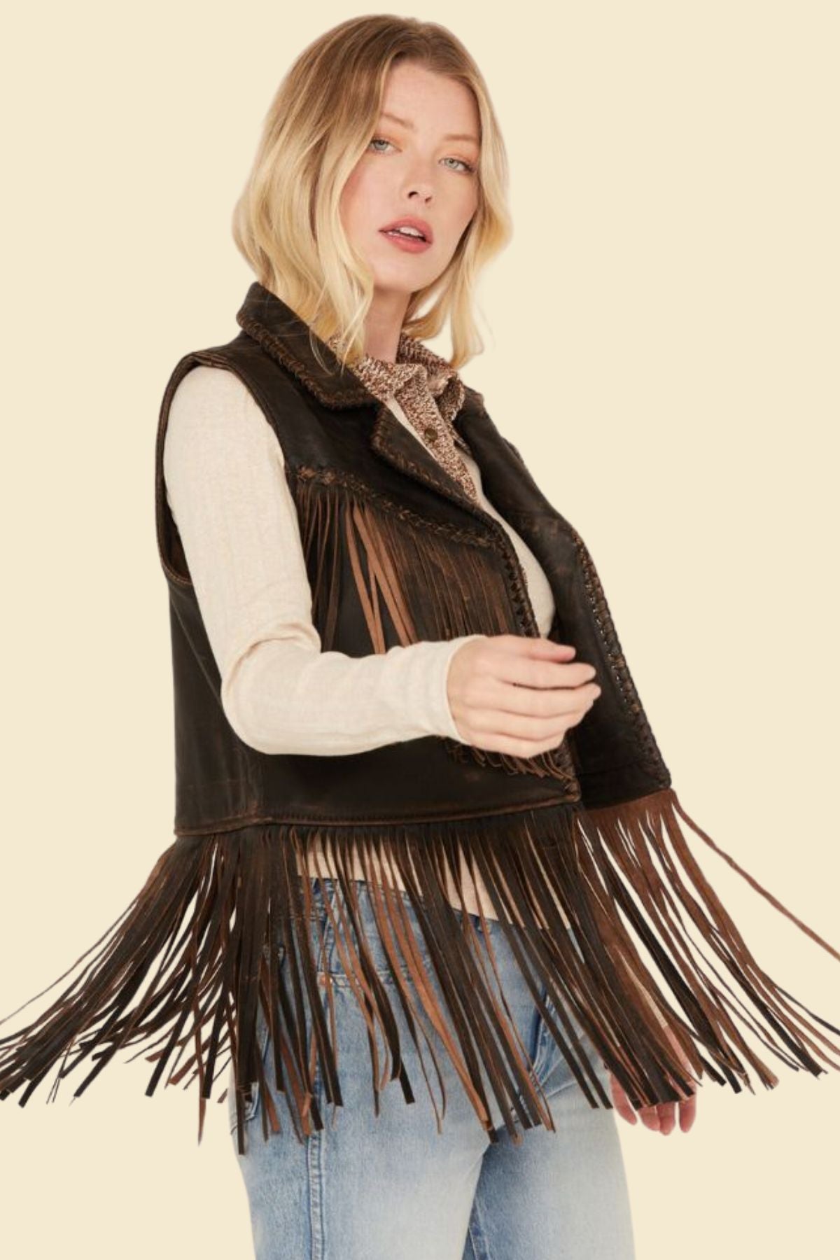 Women’s sheepskin leather vest with fringe details and soft lining.