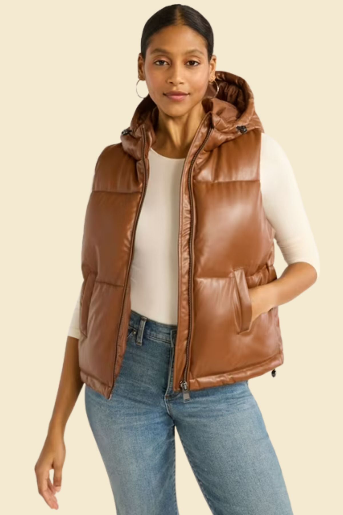 Stylish brown leather vest featuring puffer padding and casual hood.