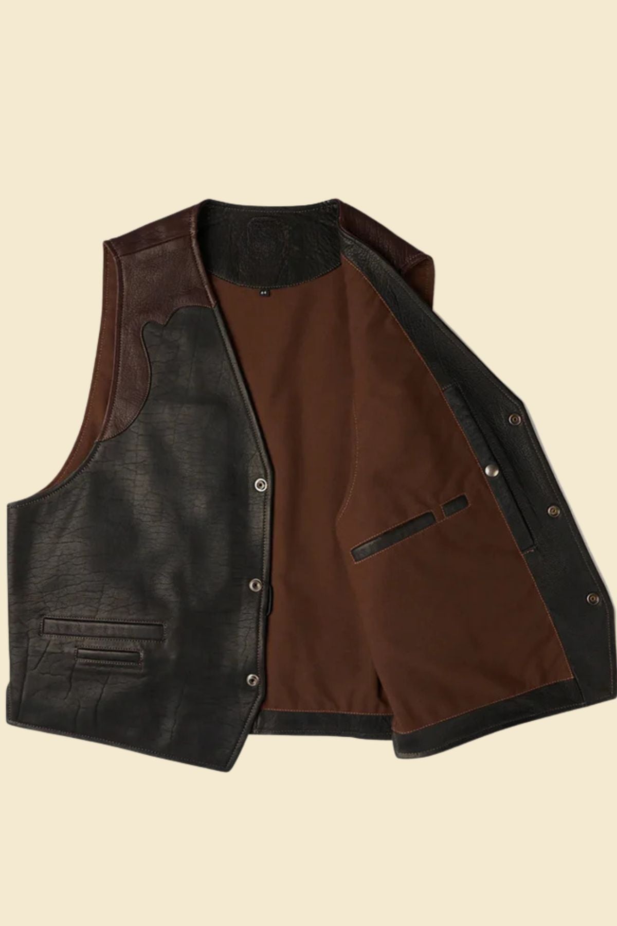 sheepskin leather cowboy vest styled with boots and denim for a Western-inspired look.