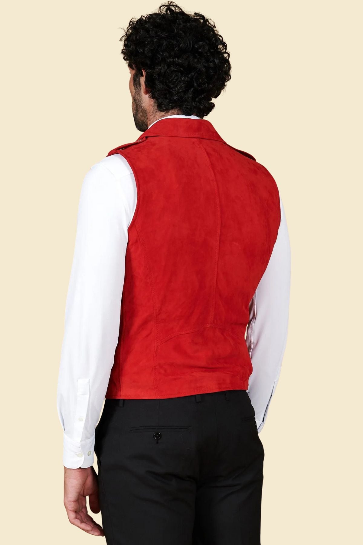 Close-up of soft suede leather texture and stitching on red biker vest for men.