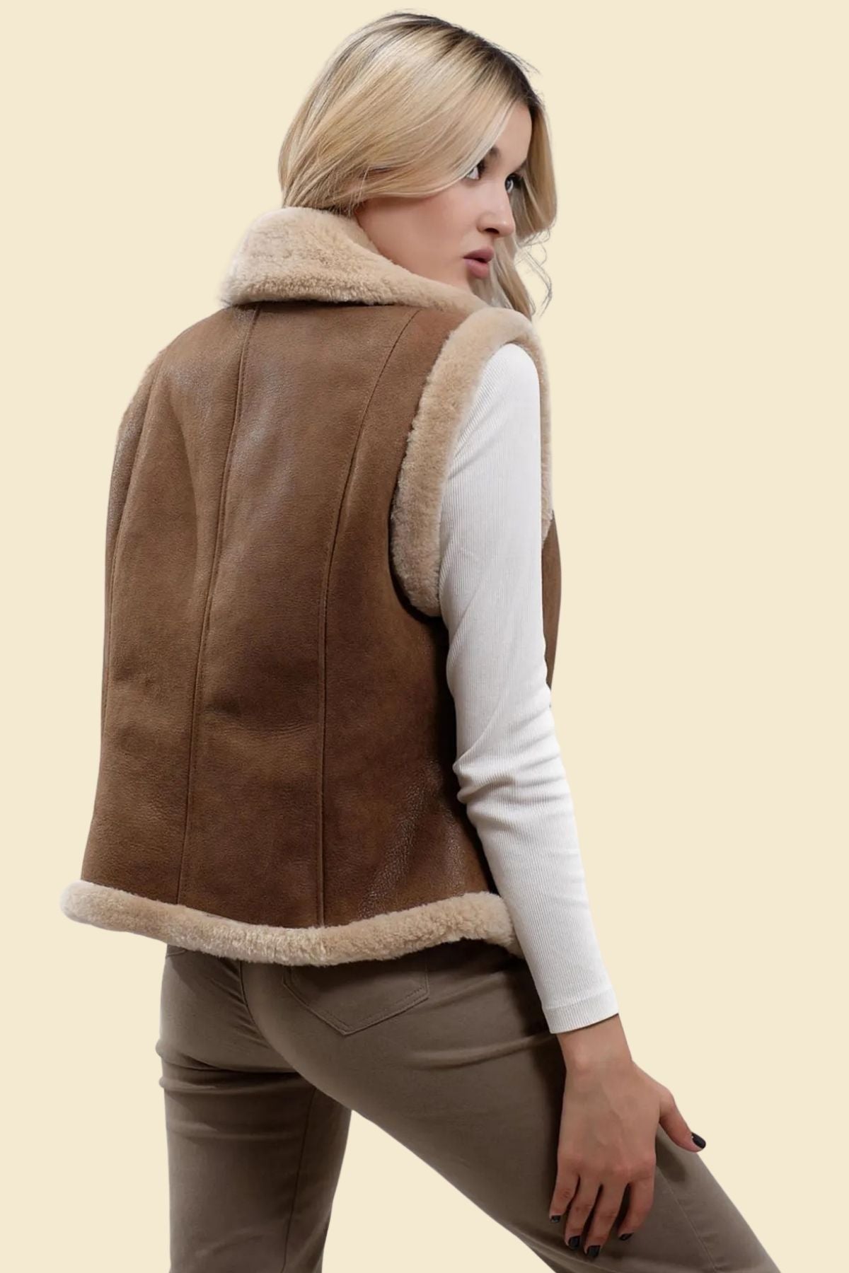 soft shearling lining inside a brown B3 leather vest for women.