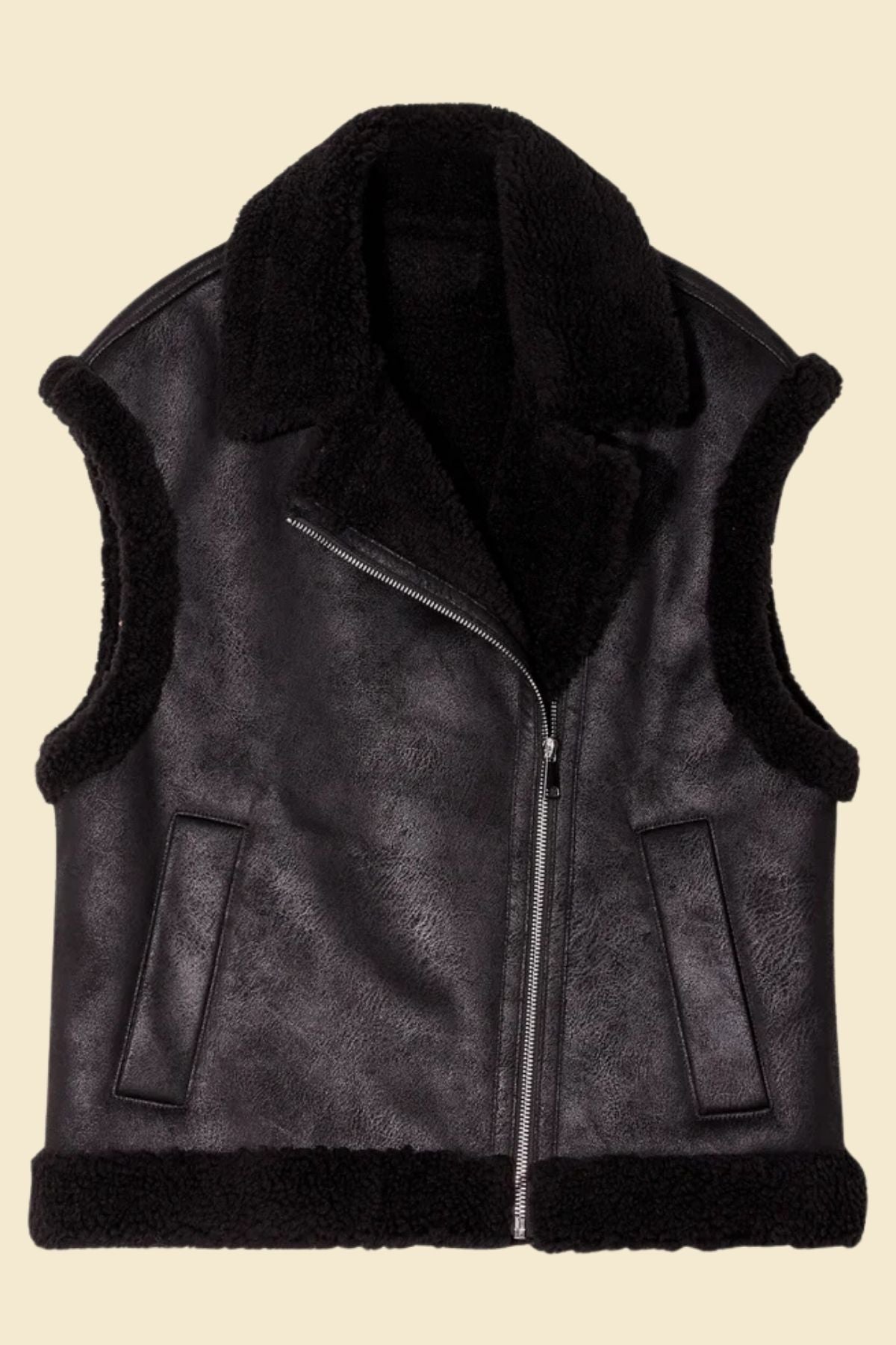 Close-up of distressed leather texture and fur collar on women’s aviator vest.