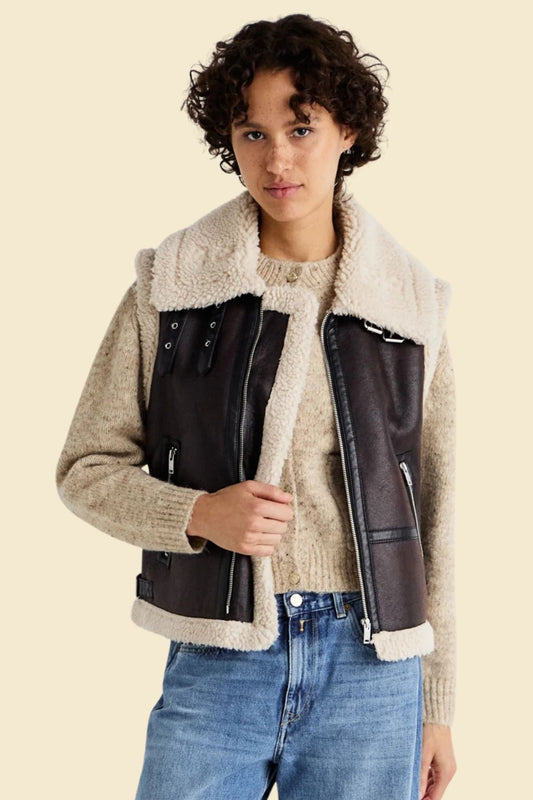 Vintage leather flight gilet featuring soft fur interior and structured bomber style.