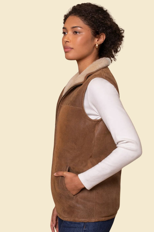 Sleeveless bomber jacket in rich brown leather featuring a cozy faux fur interior.