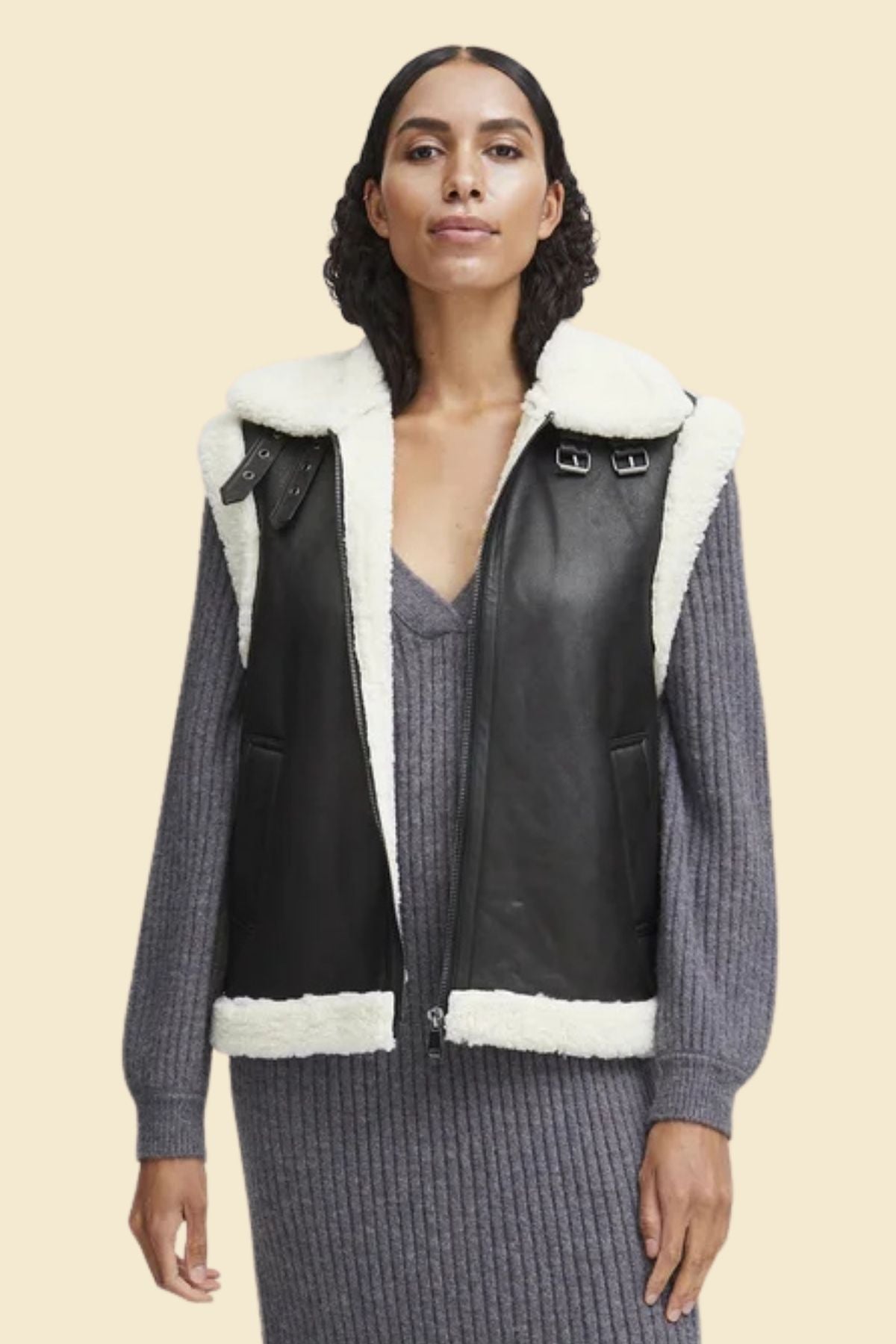 Women’s sheepskin leather vest with soft sherpa fur lining for winter style.