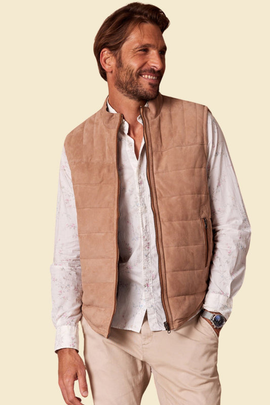 Men’s beige suede puffer vest with quilted texture and zip front.