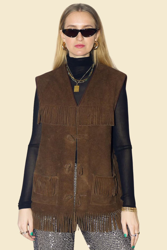 women’s Western-style brown suede vest with fringe.