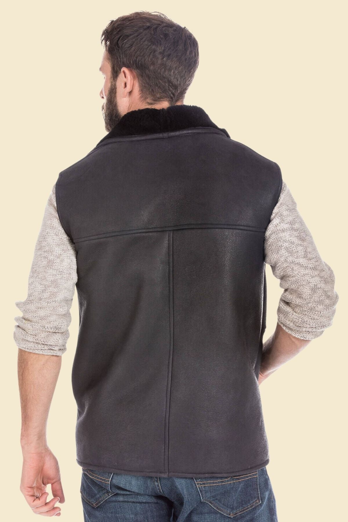 Man wearing black leather vest styled for everyday casual urban look