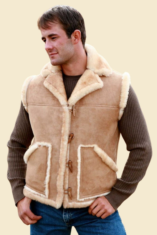 Model styled in full cowboy look wearing Western fur vest with jeans, boots, and a hat.