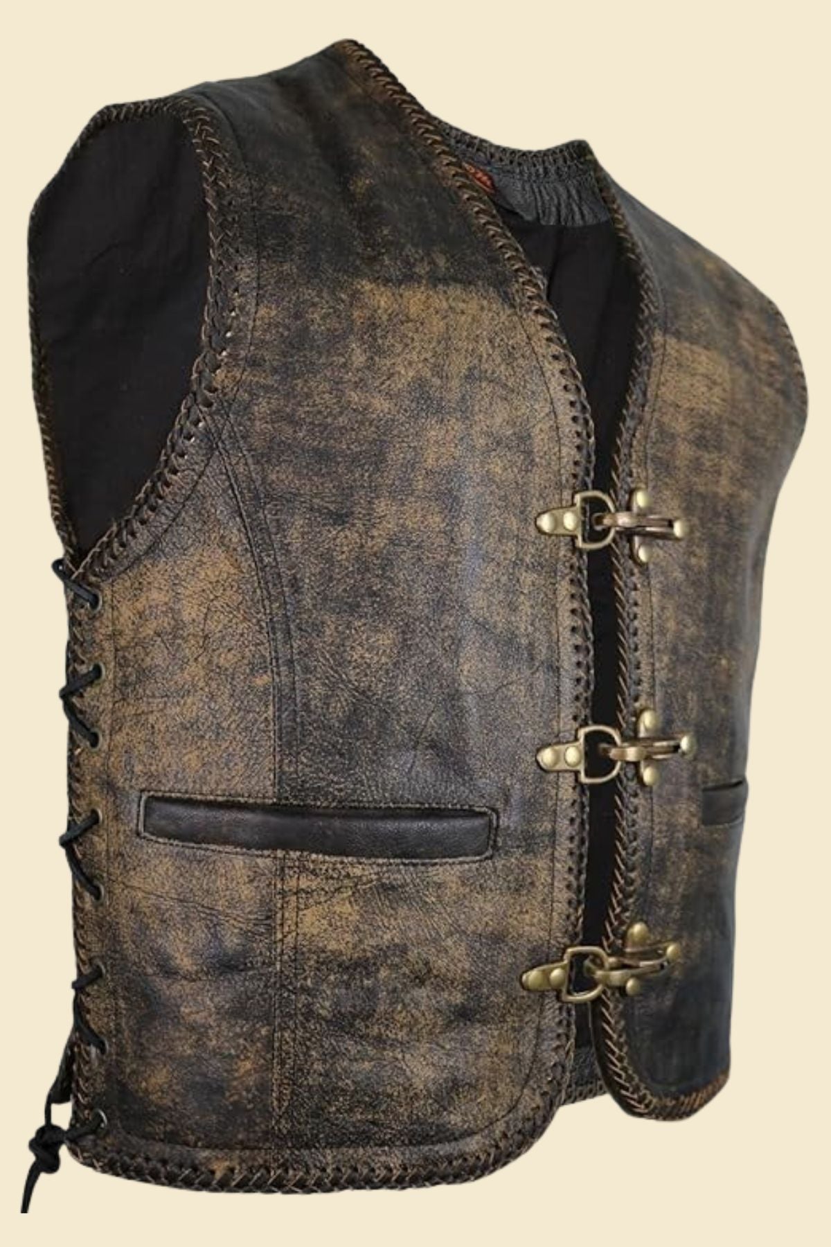 distressed leather biker vest with jeans and boots for a rugged street-ready look.