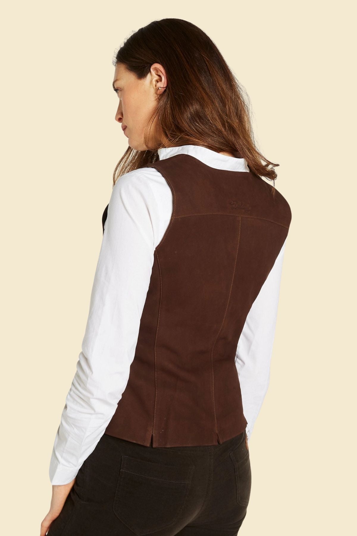 Women’s Western vest in genuine suede, styled with denim jeans.