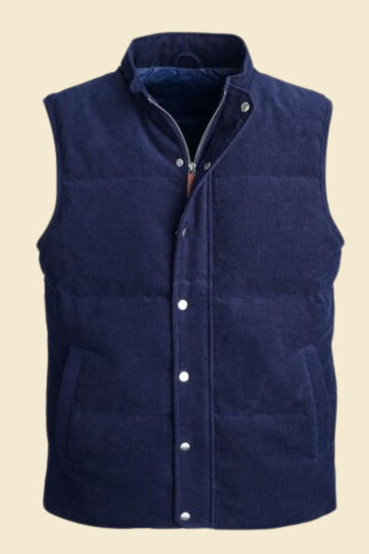 Men’s blue suede puffer vest with quilted design and full front zipper.