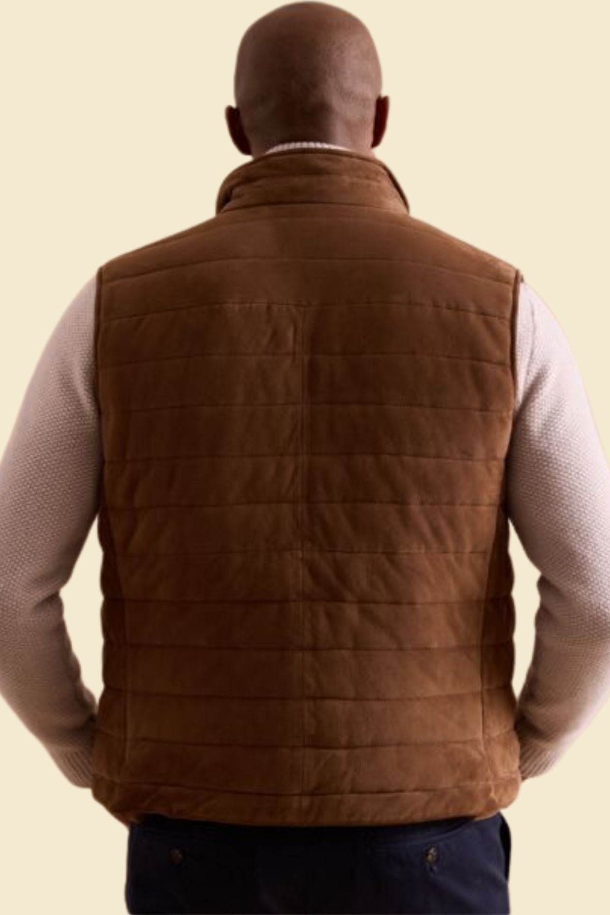 Stylish quilted vest in suede texture for men, featuring lightweight warmth.