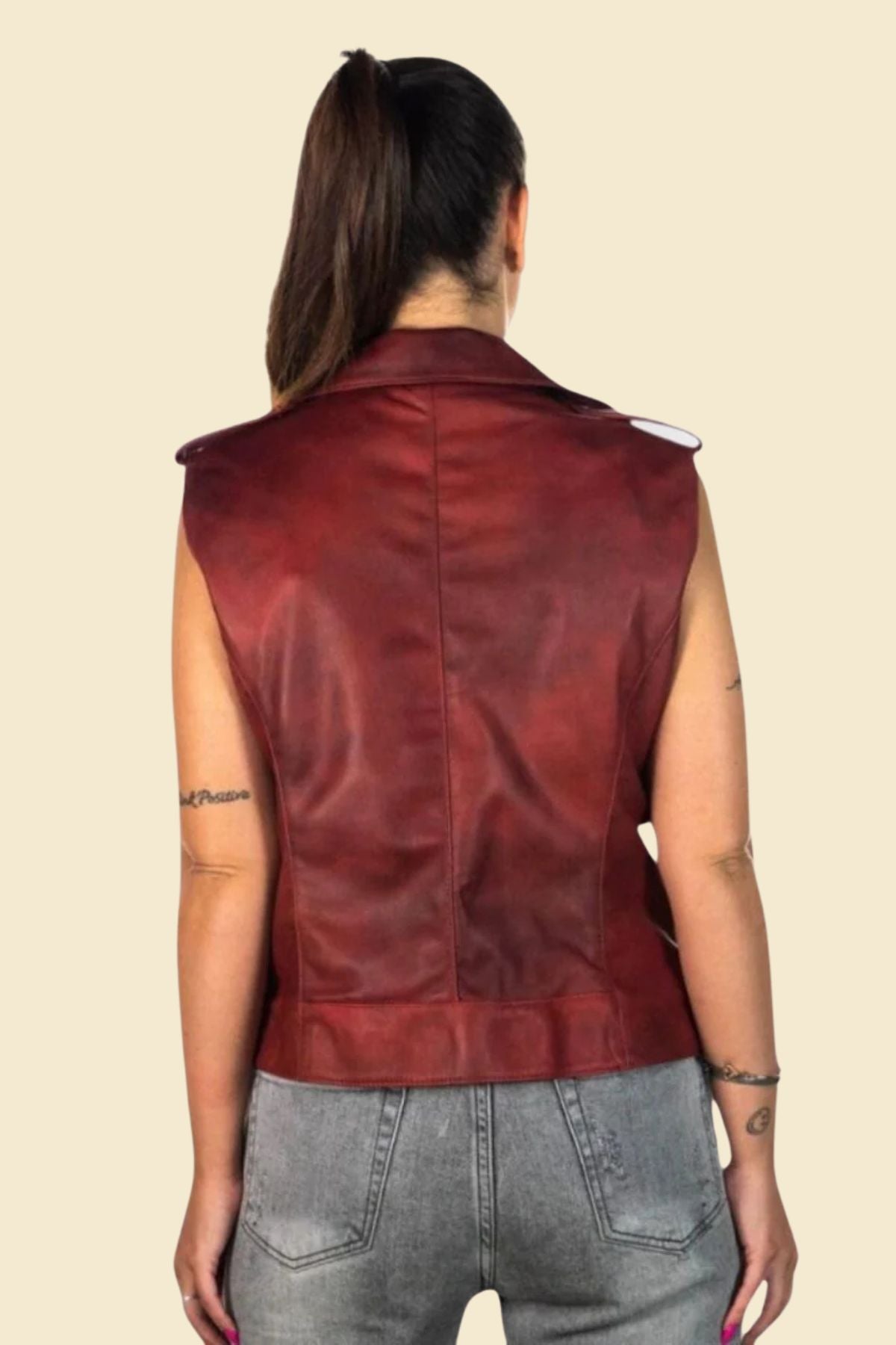 Red leather biker vest for women with tailored feminine fit.