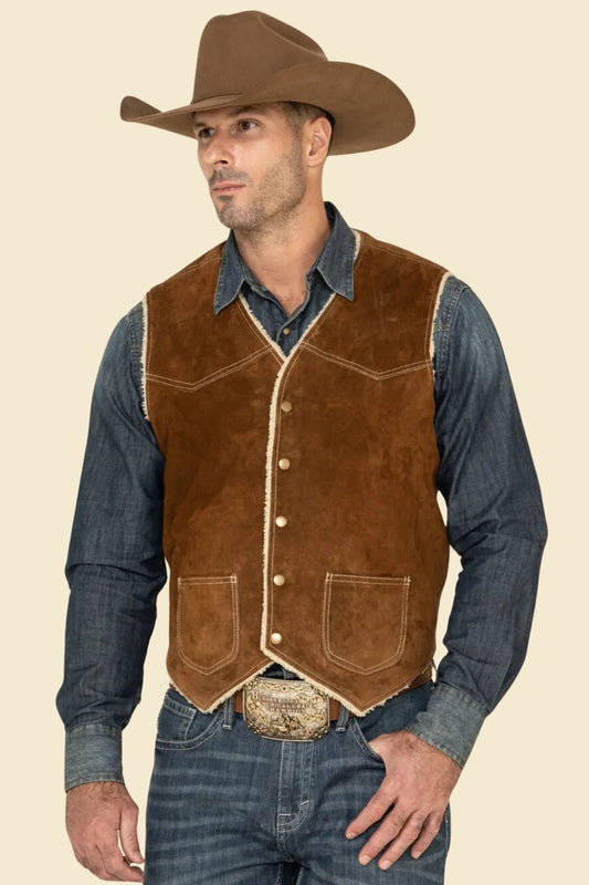 men’s rugged cowboy vest in suede leather styled with denim and boots.