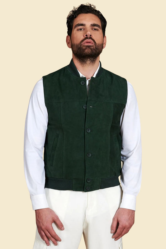 green suede vest styled in rugged urban streetwear with hoodie and boots.