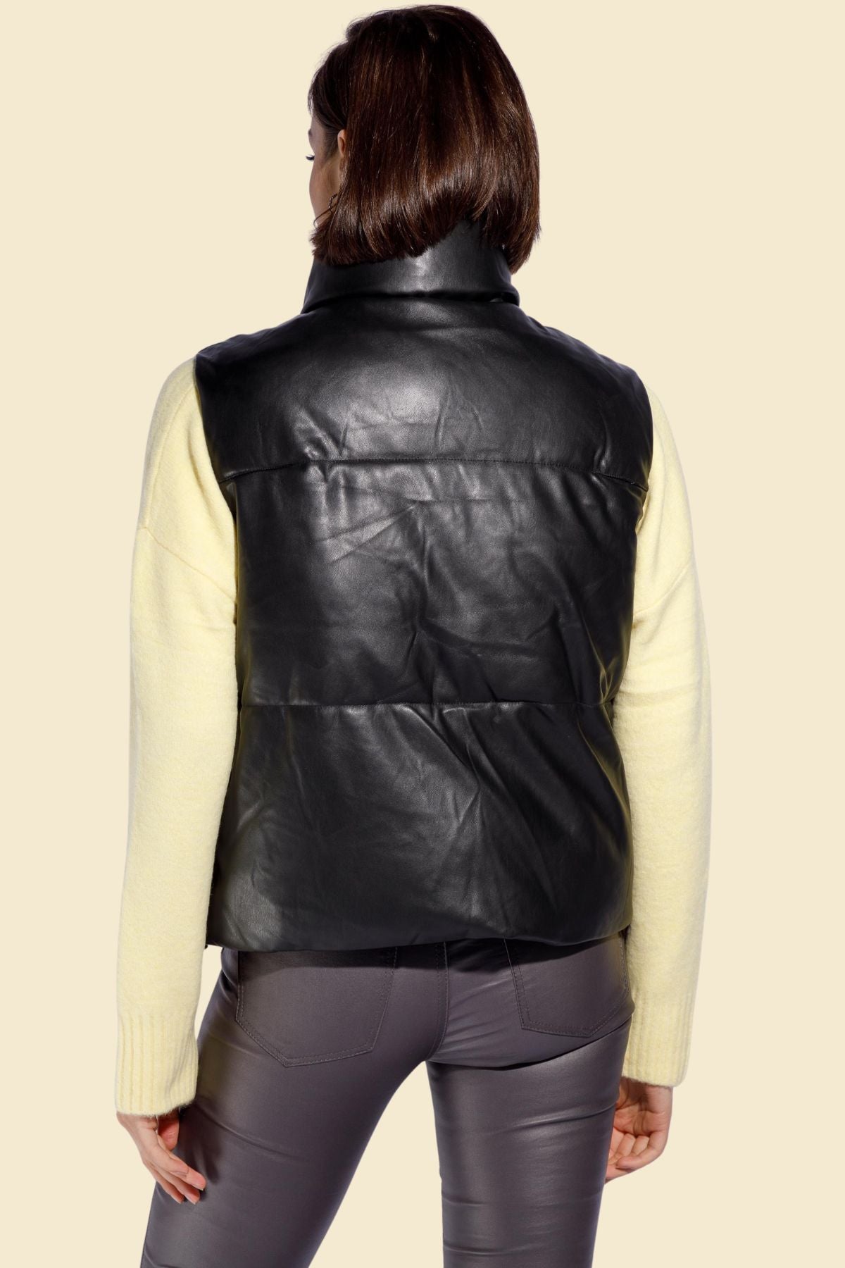 black leather puffer vest crafted from soft sheepskin.