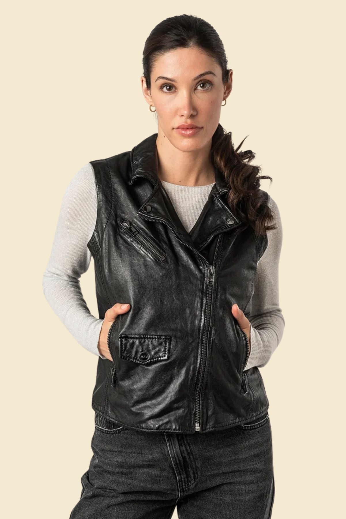 Women’s black motorcycle vest made from genuine sheepskin leather with a classic biker cut.
