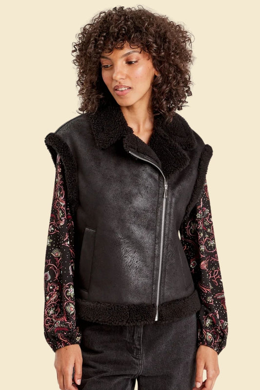 Women’s distressed black sheepskin aviator vest with faux fur lining.