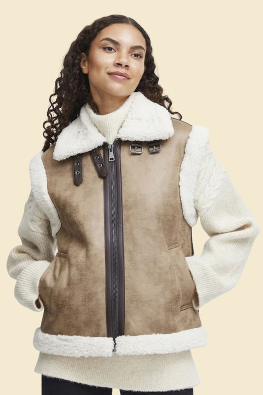 Women’s distressed brown sheepskin leather vest with faux sherpa fur lining.