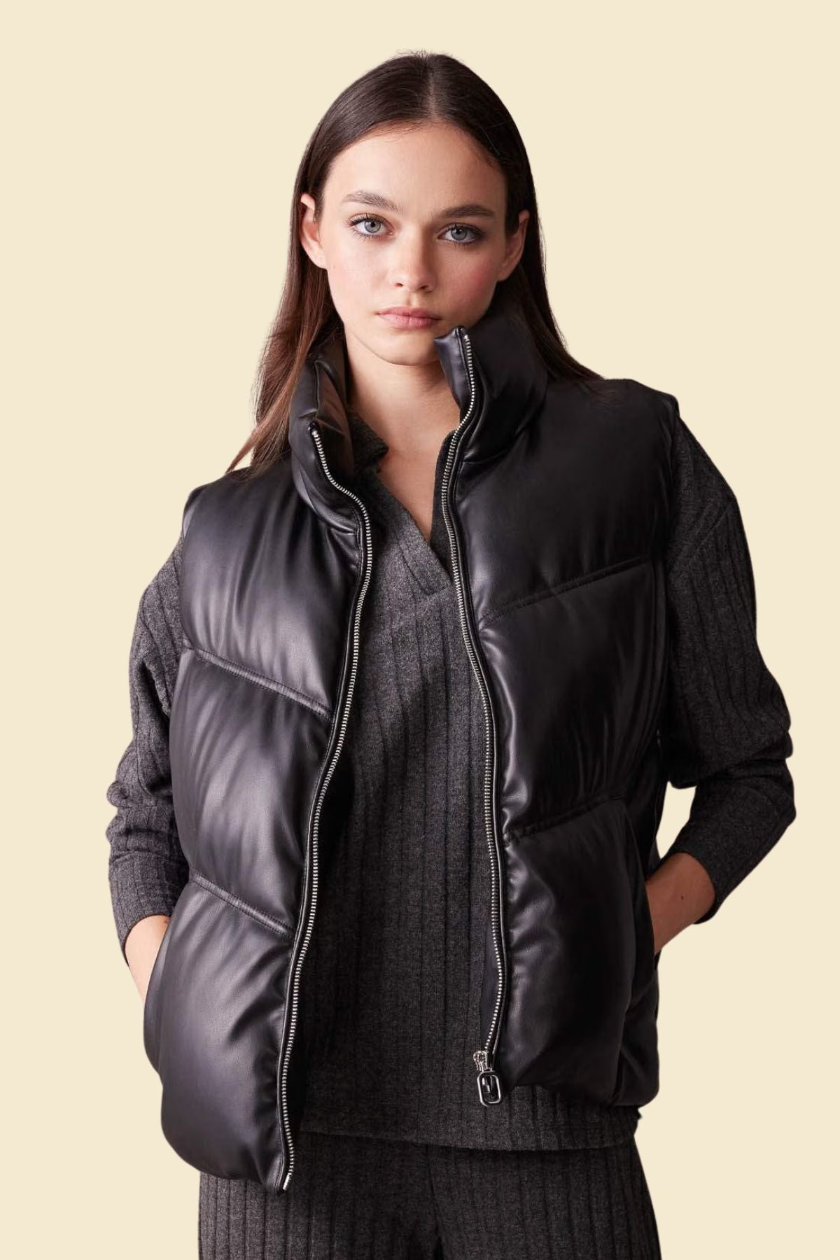 Black leather down vest for plus size women, perfect for layering.