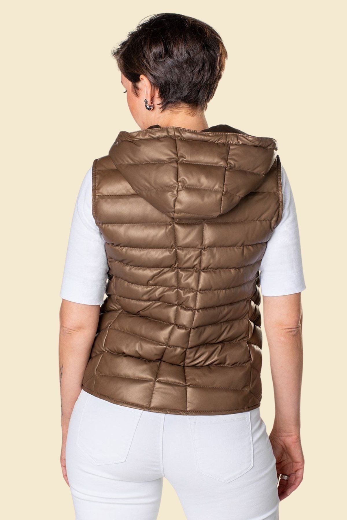 Stylish hooded puffer vest for women in rich brown leather.