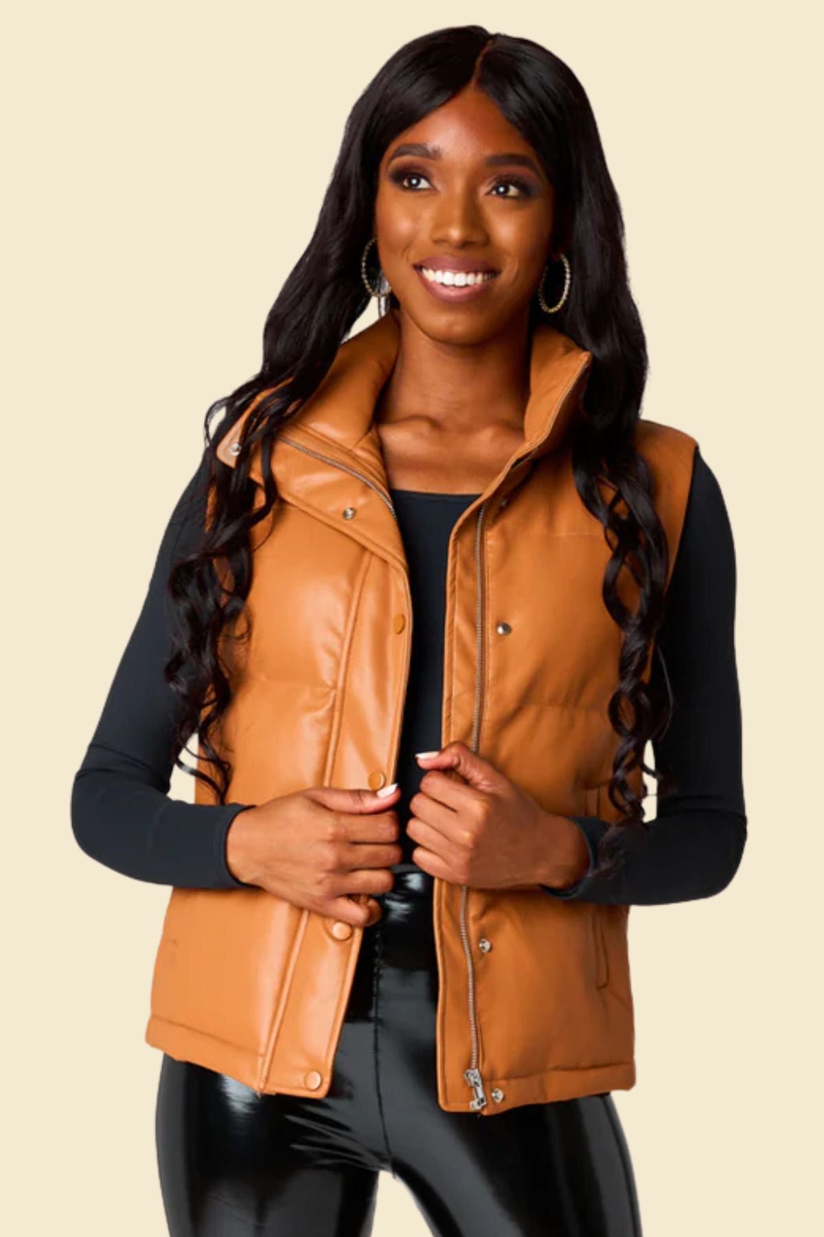 Women’s genuine sheepskin leather puffer vest in rich brown color.
